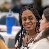 Smiling woman listening to a friend